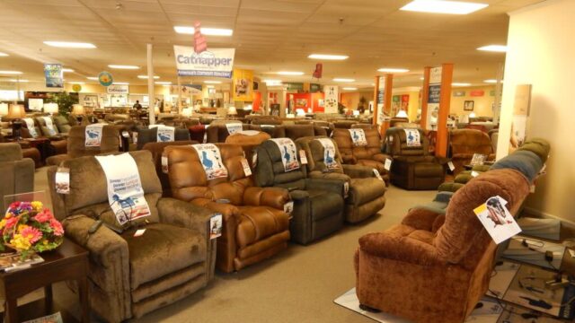 Rows of recliner chairs for sale in a furniture store