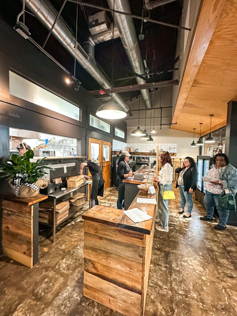 A woman orders at a counter at Incorrigible Cafe