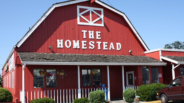 Entrance to The Homestead, a red barn-like building