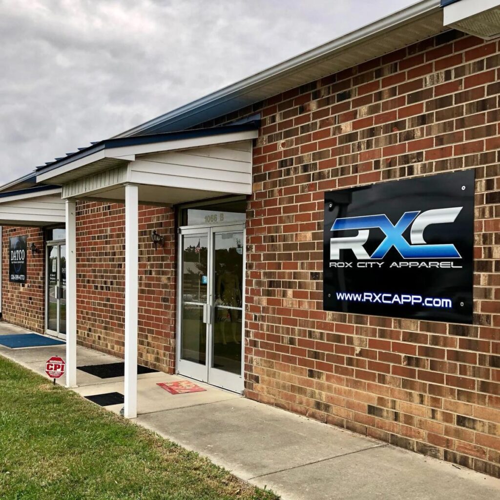 The front entrance to Rox City Apparel in a red brick building