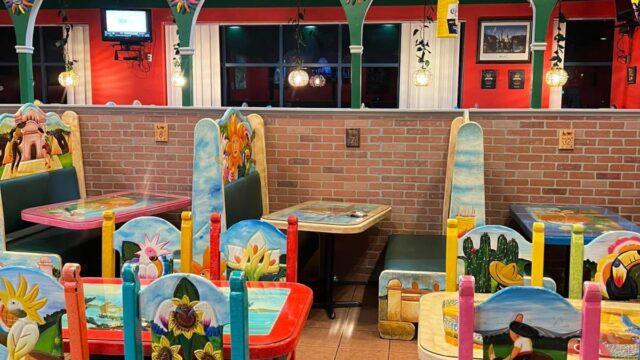 Colorful painted wooden tables and chairs at a Mexican restaurant