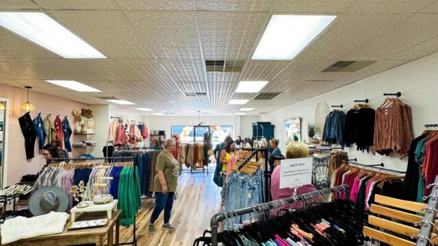 A boutique store with racks of clothing ready for shoppers