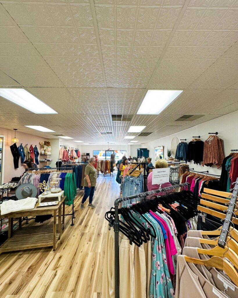 A boutique store with racks of clothing ready for shoppers